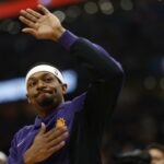 Phoenix Suns guard Bradley Beal (3) waves to the crowd while being introduced prior his return to Washington after being traded in the offseason against the Washington Wizards at Capital One Arena.