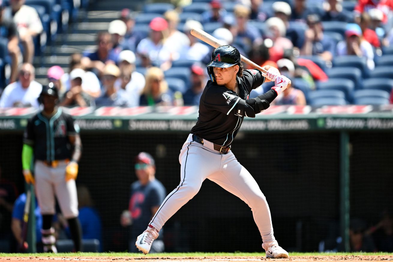 Alek Thomas bats while wearing the Diamondbacks black tops with white pants