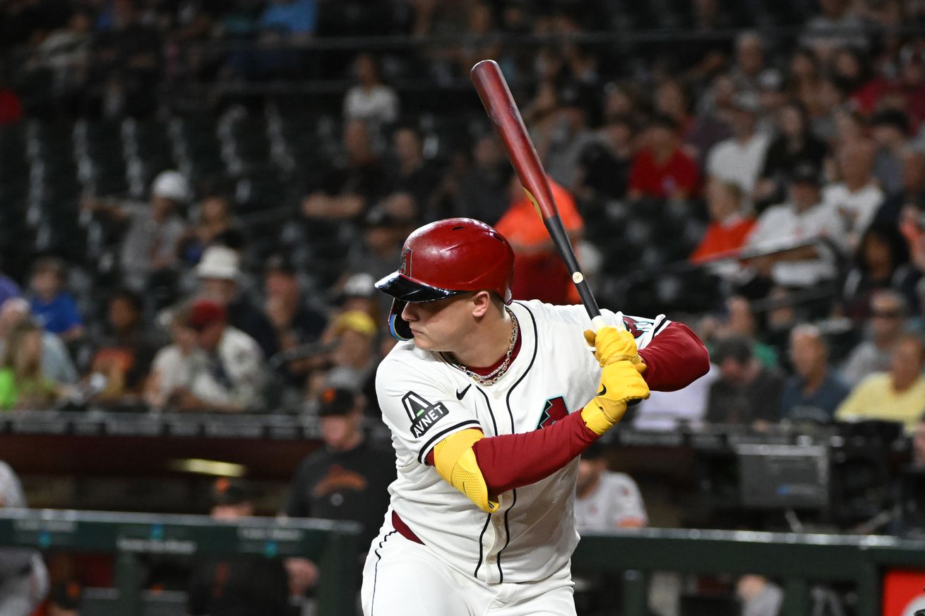 Joc Pederson gears up to swing while wearing the Diamondbacks’ home white uniforms