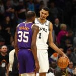 San Antonio Spurs center Victor Wembanyama (1) talks with Phoenix Suns forward Kevin Durant (35)