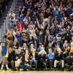 Fans cheer for Golden State Warriors forward Jonathan Kuminga (00)