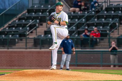 Mason Marriott, mid wind-up, prepares to deliver at pitch for the Baylor Bears