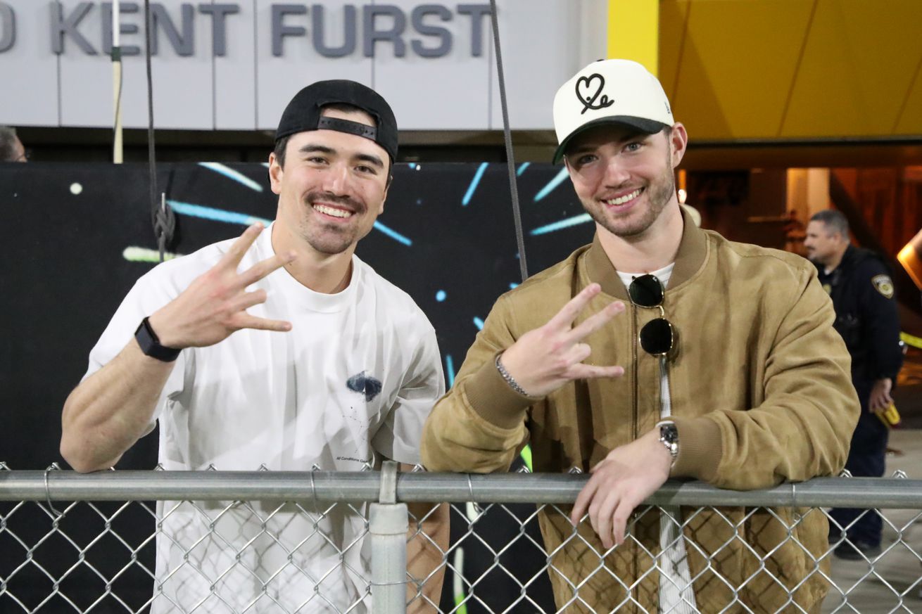 Corbin Carroll and Bryce Jarvis at college football game.