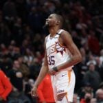 Feb 3, 2025; Portland, Oregon, USA; Phoenix Suns forward Kevin Durant (35) laughs as he watches a replay of his teammate SunsÕ guard Devin Booker (1) being fouled by Portland Trail Blazers forward Deni Avdija (8) in overtime at Moda Center. Mandatory Credit: Jaime Valdez-Imagn Images