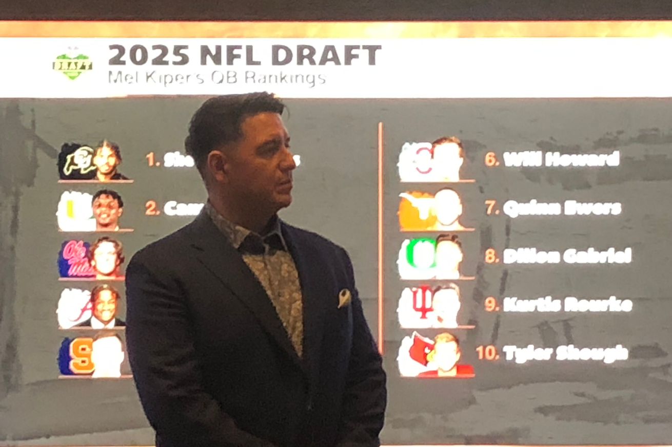 The president of a casino stands in front of a draft board at his casino preparing for the NFL Draft