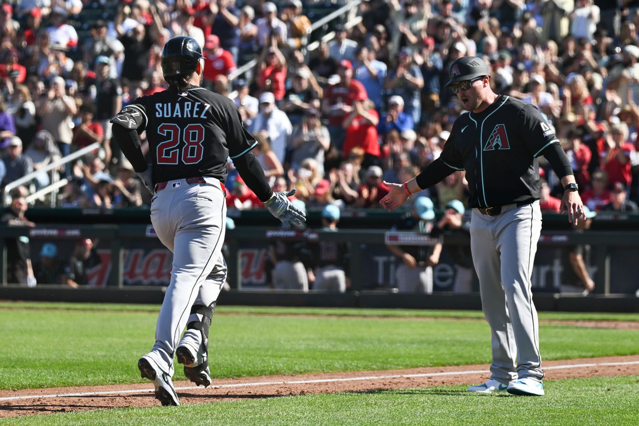 Eugenio Suarez celebrates a grand slam in spring training.