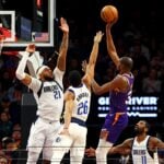 Phoenix Suns forward Kevin Durant scores over Dallas Mavericks