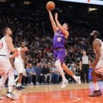 Mar 4, 2025; Phoenix, Arizona, USA; Phoenix Suns guard Collin Gillespie (12) shoots against the LA Clippers during the second half at PHX Center. Mandatory Credit: Joe Camporeale-Imagn Images